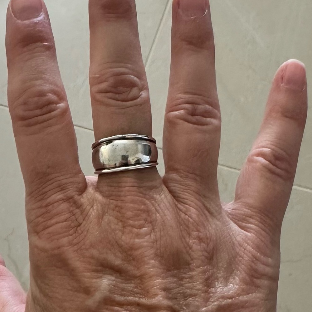 Wide sterling silver ring.